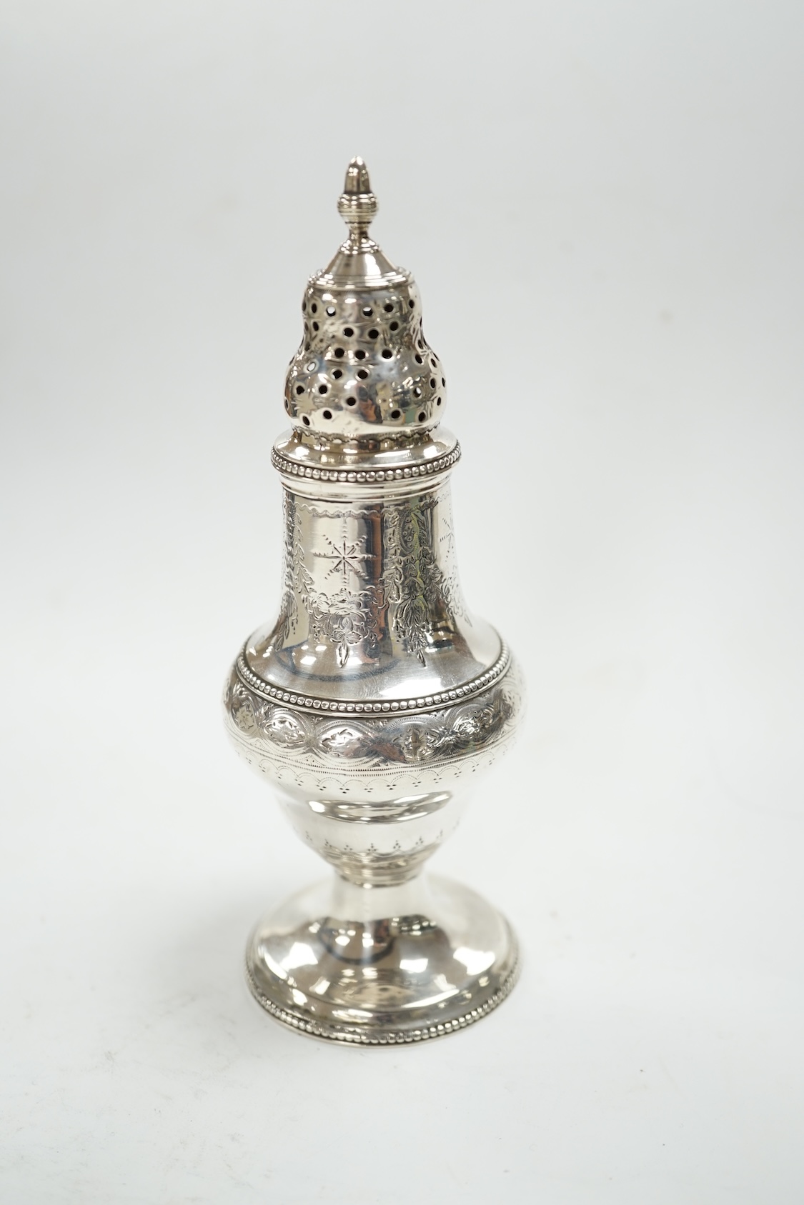 A George III silver baluster pepperette, Thomas Daniell, London, 1785, 14.6cm. Condition - poor